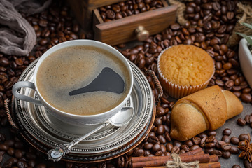 Black coffee on an old background in a cup