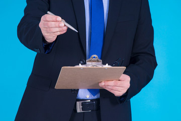 man with suit and documents and pen
