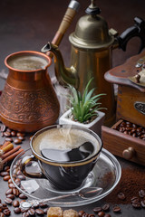 Black coffee on an old background in a cup