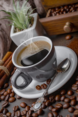 Coffee in a cup and saucer on an old background.