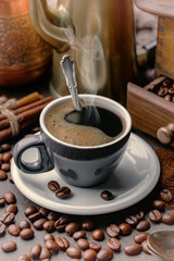 Black coffee on an old background in a cup