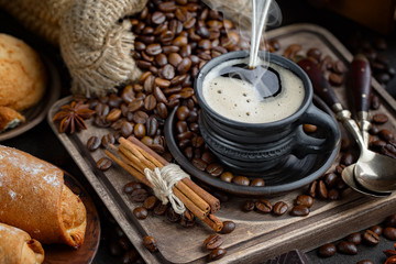 Black coffee on an old background in a cup