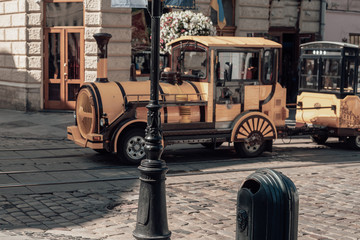 Yellow touristic Train in old city. Old locomotive