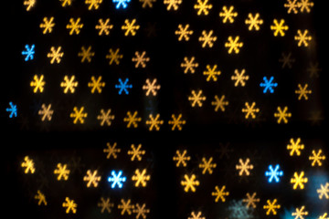 Bright snowflakes bokeh background. Happy new year
