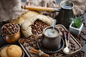 Black coffee on an old background in a cup