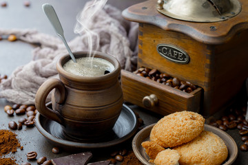 Coffee in a cup and saucer on an old background.