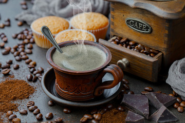 Black coffee on an old background in a cup