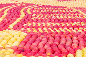 Background of lots of red and yellow apples cover with water drop