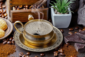 Black coffee on an old background in a cup