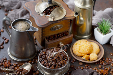 Coffee in a cup and saucer on an old background.