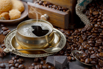 Black coffee on an old background in a cup