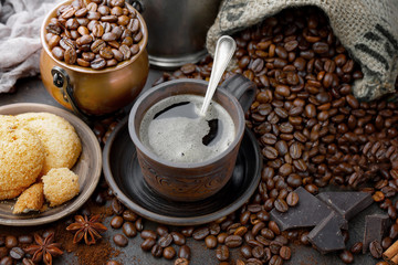 Black coffee on an old background in a cup