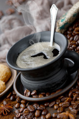 Coffee in a cup and saucer on an old background.