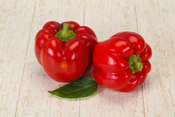 Ripe Red bell pepper over wooden