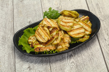 Grilled eggplant slices served basil