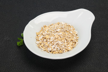 Raw oats in the bowl
