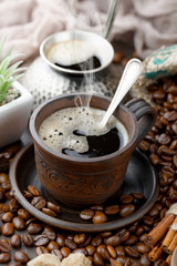 Coffee in a cup and saucer on an old background.