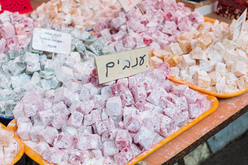 Assorted traditional turkish delighth on trays in Carmel Market, Tel Aviv, Israel. Sugar coated...