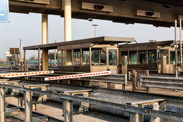 highway exit beyond the steel guardrail in the afternoon