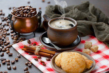 Black coffee on an old background in a cup