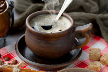 Black coffee on an old background in a cup