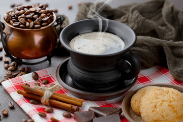 Coffee in a cup and saucer on an old background.