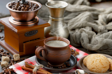 Coffee in a cup and saucer on an old background.