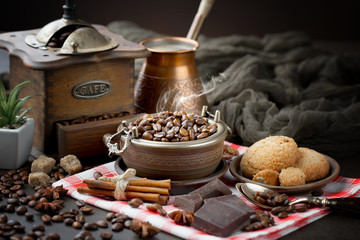 Coffee grains on a table with accessories for coffee