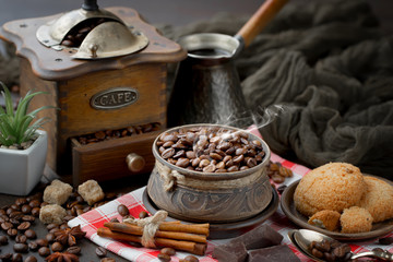 Coffee grains on a table with accessories for coffee