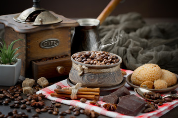 Coffee grains on a table with accessories for coffee