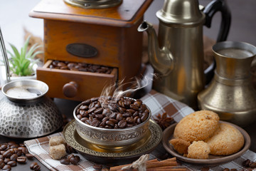 Coffee grains on a table with accessories for coffee
