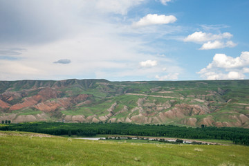 Fototapeta na wymiar Landscape of alpine meadows,valley,river and blue sky