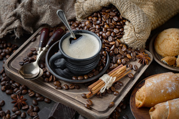 Coffee in a cup and saucer on an old background.