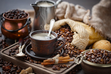 Coffee in a cup and saucer on an old background.