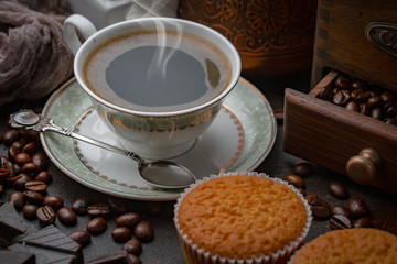 Black coffee on an old background in a cup