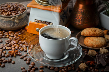 Coffee in a cup and saucer on an old background.