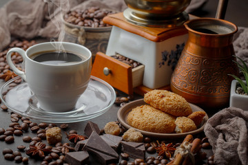 Coffee in a cup and saucer on an old background.