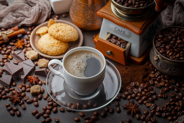 Coffee in a cup and saucer on an old background.