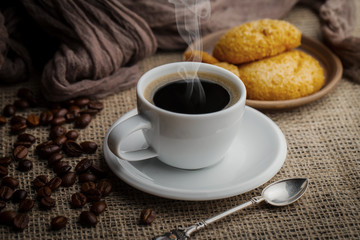 Black coffee on an old background in a cup