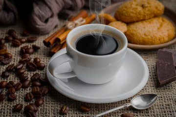 Black coffee on an old background in a cup