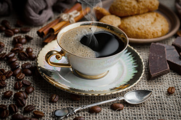 Black coffee on an old background in a cup