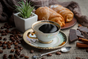 Black coffee on an old background in a cup