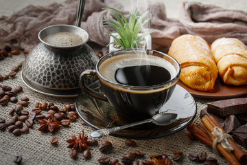 Black coffee on an old background in a cup