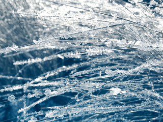 winter background with snowflakes crystals patterns and snow on frozen grass