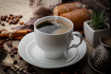 Black coffee on an old background in a cup