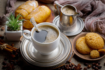 Black coffee on an old background in a cup