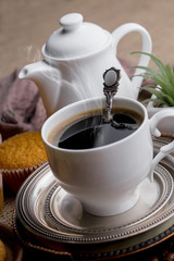 Black coffee on an old background in a cup