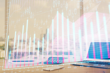 Forex Chart hologram on table with computer background. Multi exposure. Concept of financial markets.