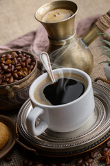 Black coffee on an old background in a cup