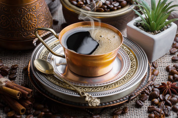 Black coffee on an old background in a cup
